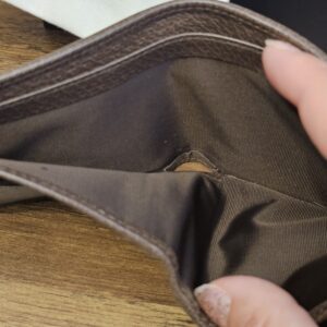 Bill compartment of the Gucci camouflage wallet held open