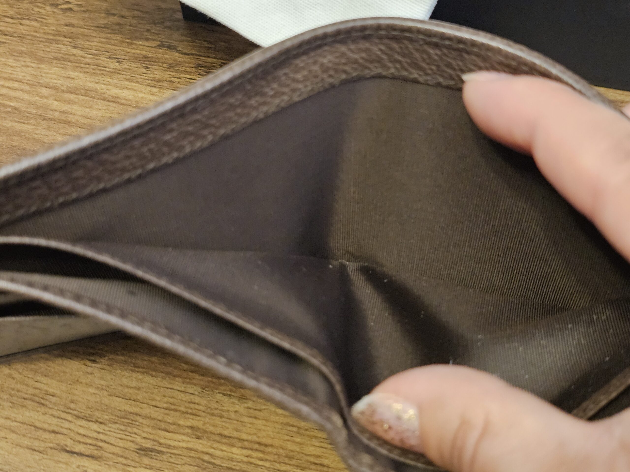 Interior lining of the Gucci bifold wallet held open