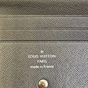 Louis Vuitton Paris made in France stamp inside the Smart Wallet beside the snap