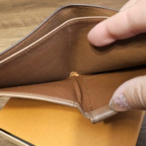 Bill compartment of the vintage Louis Vuitton wallet held open