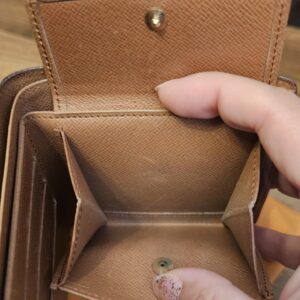 Coin pocket of the wallet opened to show the leather interior