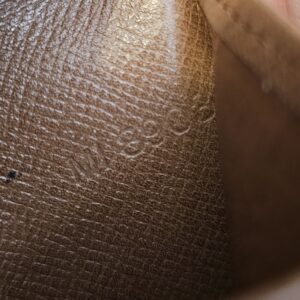 Close up of the date code MI8903 stamped inside the wallet