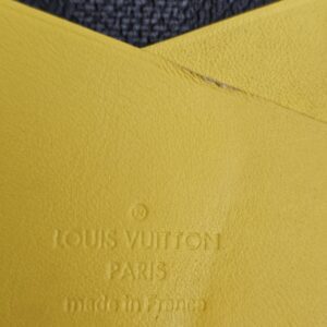 Yellow leather pocket inside the organizer with the Louis Vuitton Paris made in France stamp