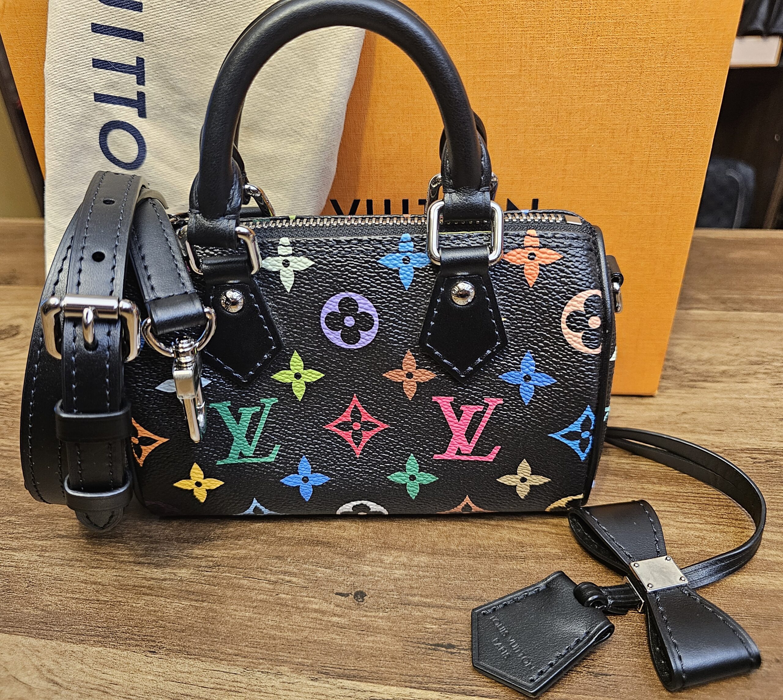 Louis Vuitton x Takashi Murakami Monogram Multicolore Noir Nano Speedy with its strap, name tag and clochette on the dust bag