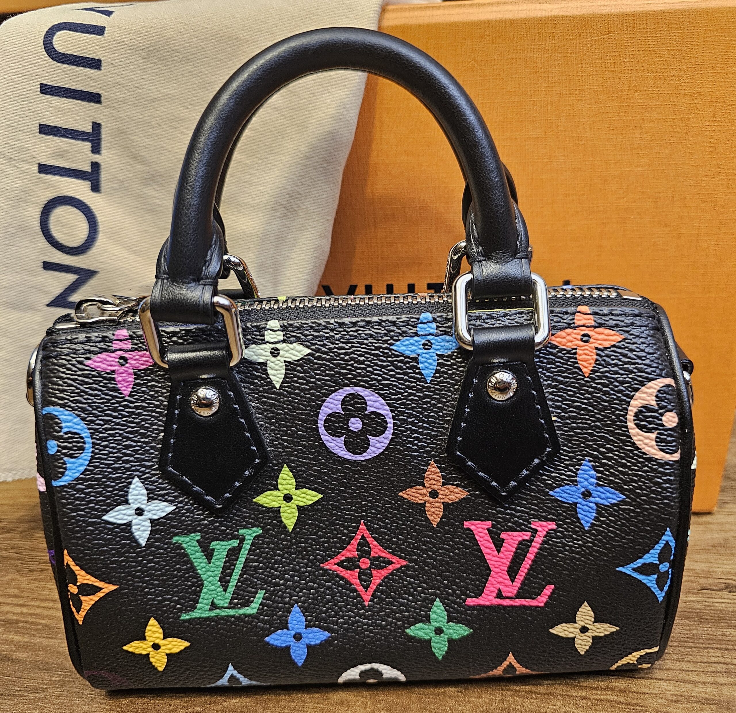 Front of the Nano Speedy showing the multicolor monogram on black coated canvas