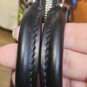 Close up of the two rolled black leather handles
