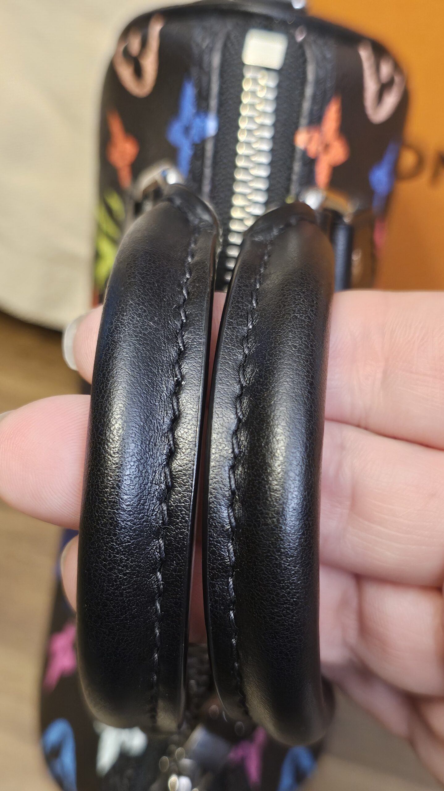 Close up of the two rolled black leather handles