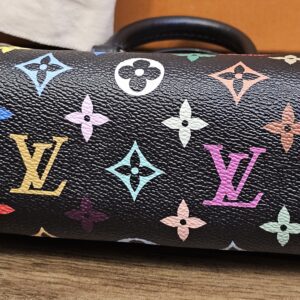 Nano Speedy on its side showing the multicolor monogram end panel