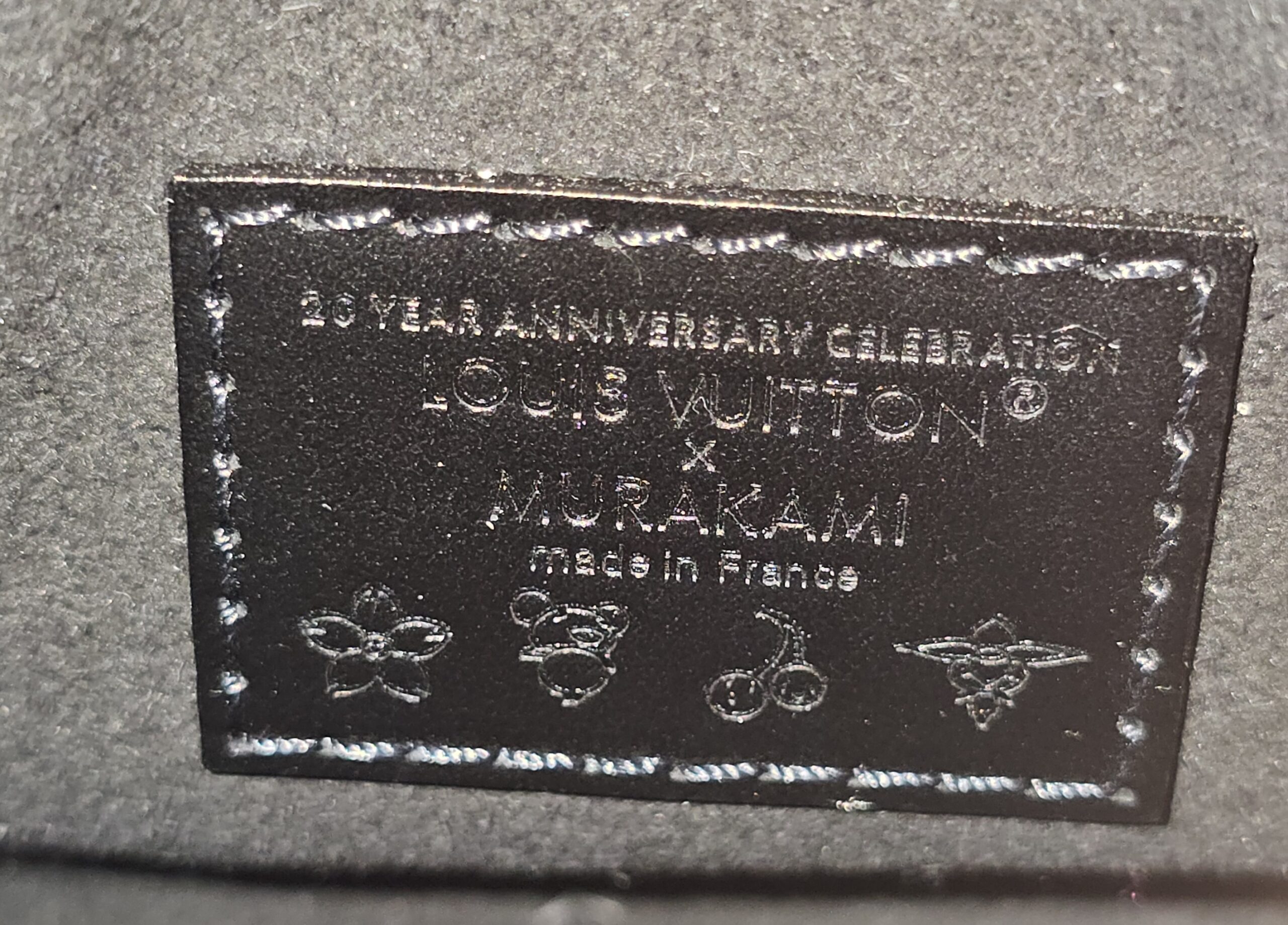 Interior plaque reading 20 Year Anniversary Celebration Louis Vuitton x Murakami made in France