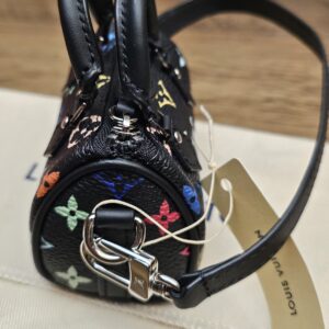 End view with the silver-tone clasp and strap