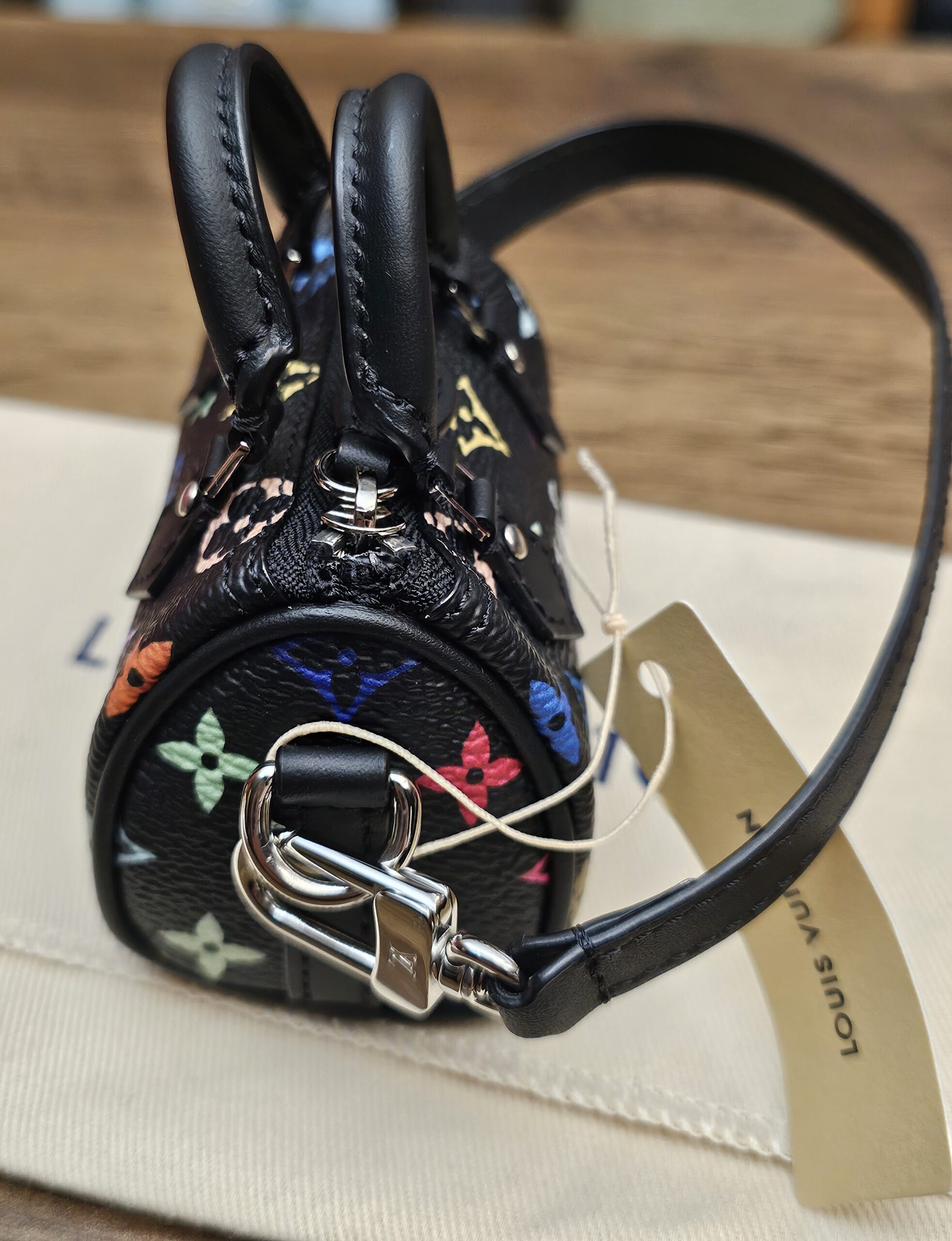 End view with the silver-tone clasp and strap