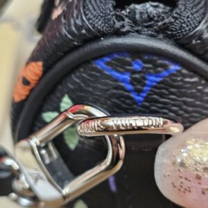 Close up of the engraved silver-tone clasp