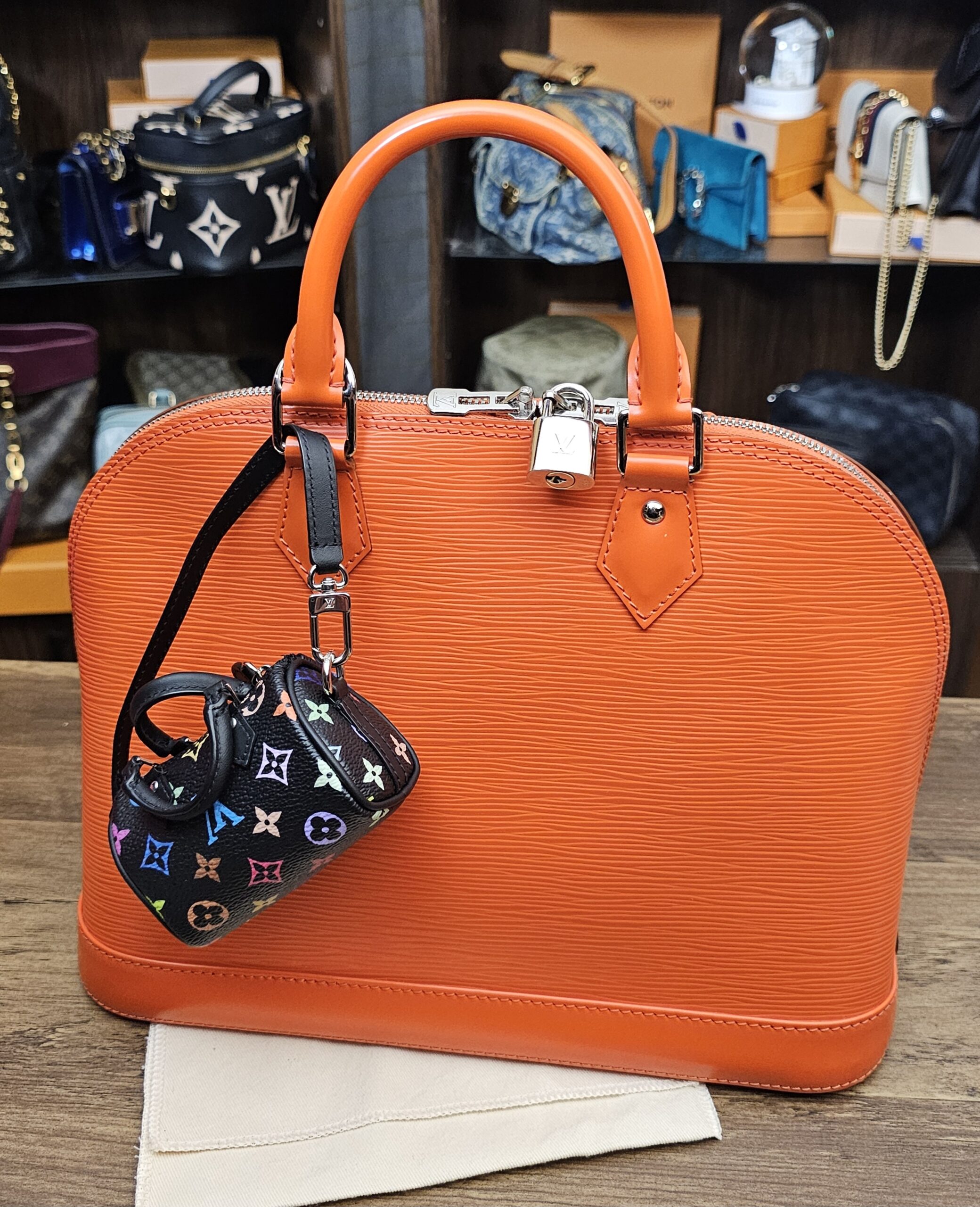 Micro Speedy hanging from an orange bag for scale