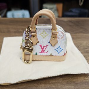 Louis Vuitton x Takashi Murakami Monogram Multicolor Micro Alma Bag Charm White - front view on its dust bag