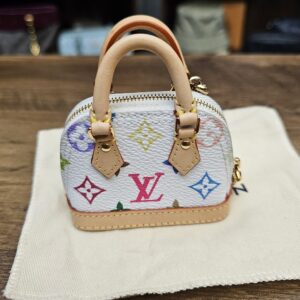 Closer front view of the white multicolor monogram and vachetta handles