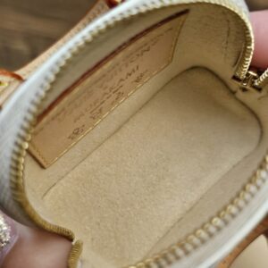 Open interior with beige lining and leather plaque