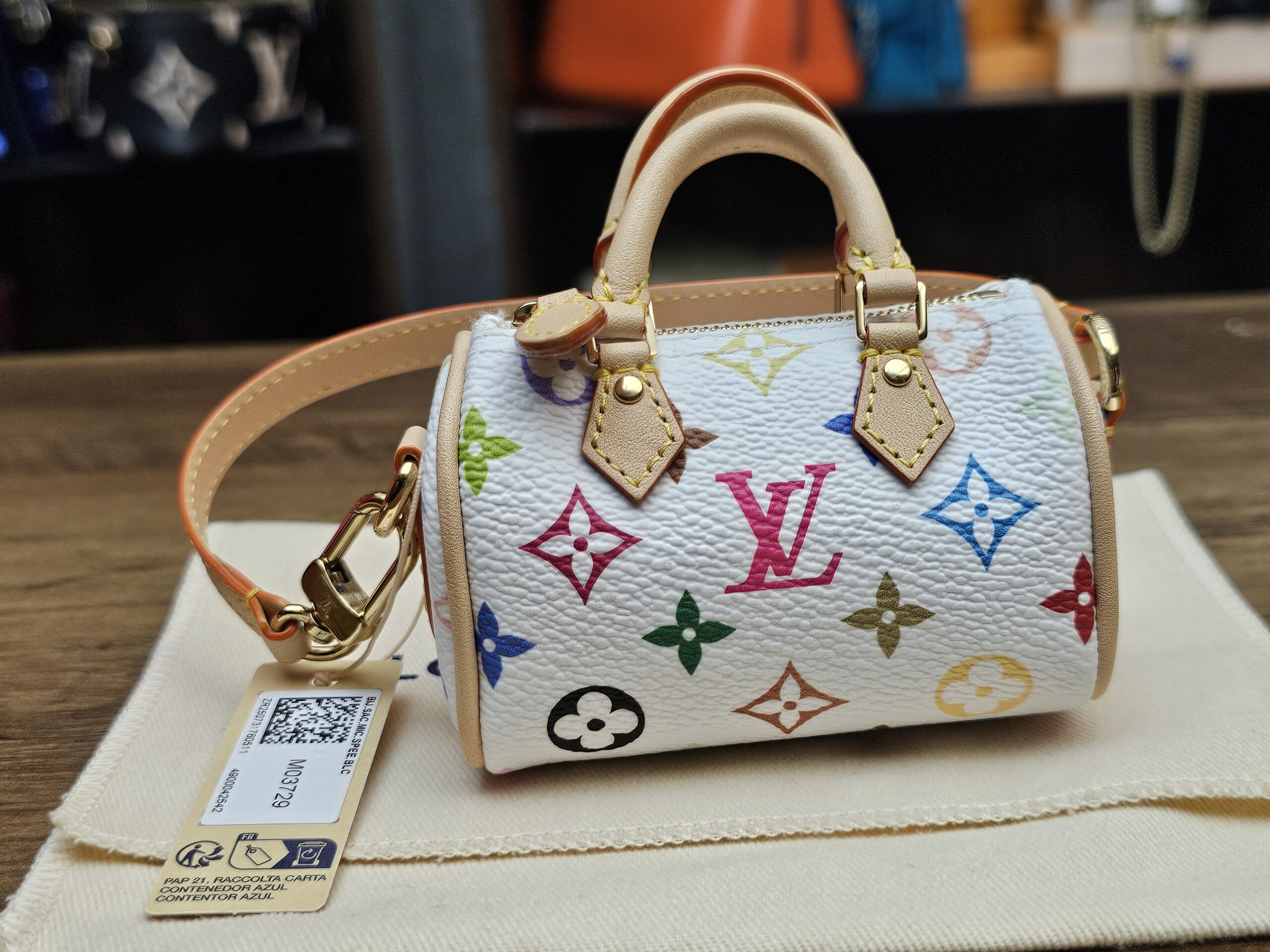 Three-quarter front view with the strap and retail tag