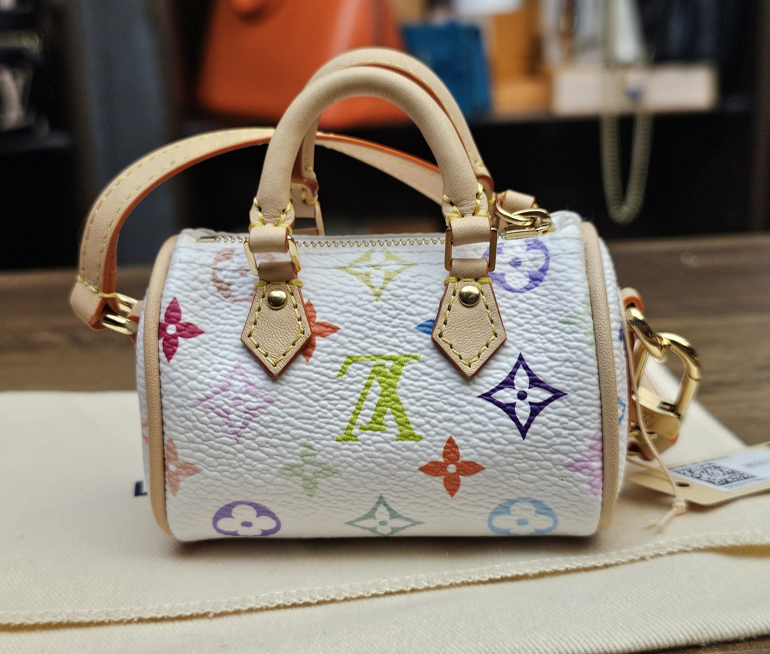 Straight front view of the white multicolor monogram
