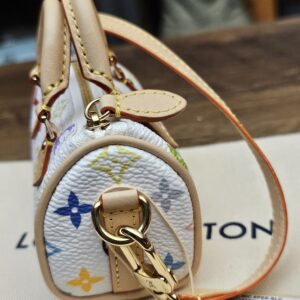 End view with the gold-tone clasp and vachetta strap