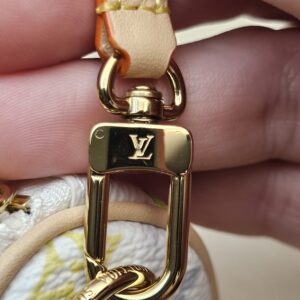 Close up of the gold-tone LV clasp on the strap