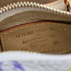 Interior leather plaque reading x Murakami made in Italy