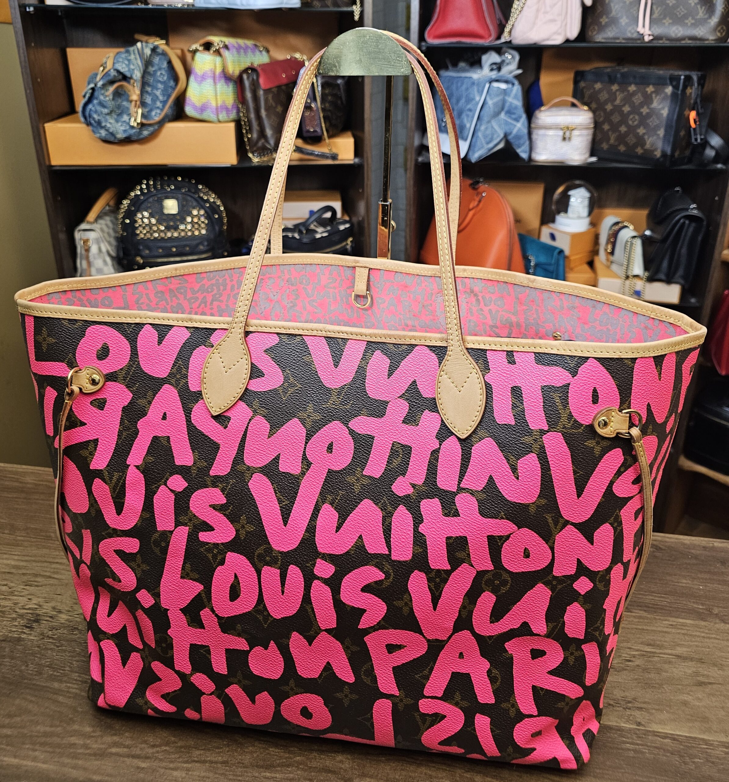 Back view of the fuchsia graffiti on Monogram canvas