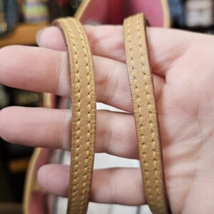 Vachetta handles held in hand