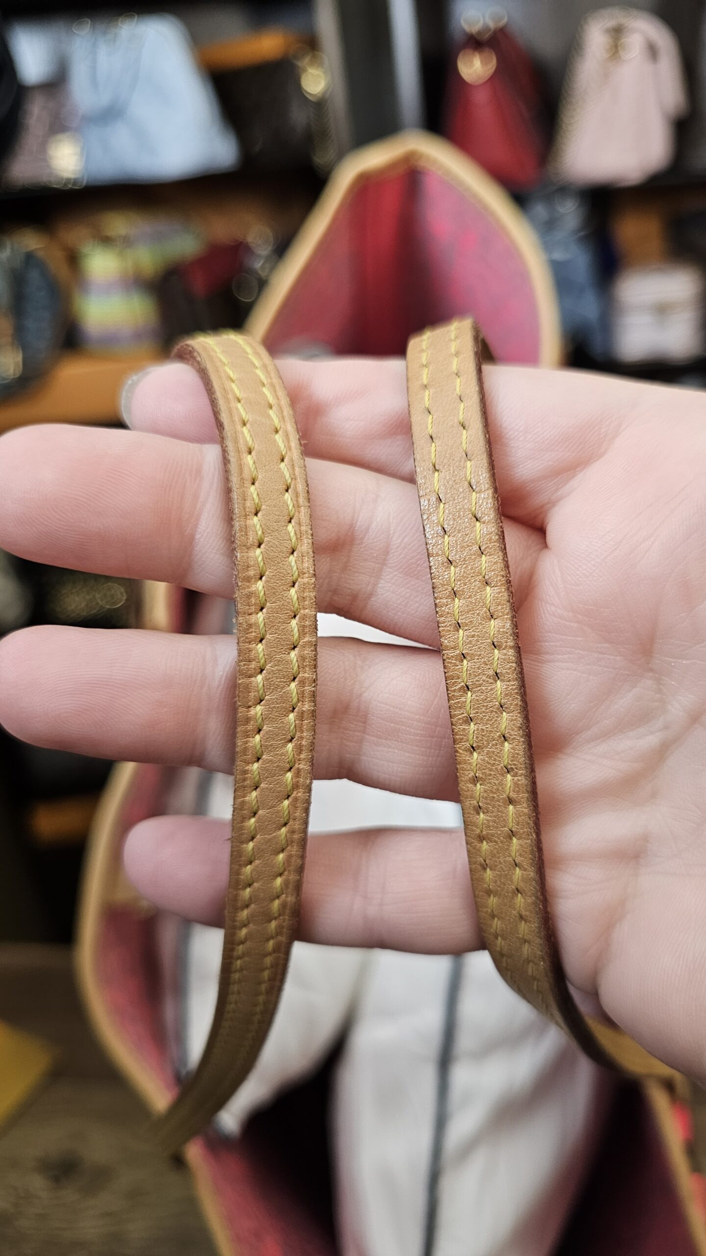 Vachetta handles held in hand