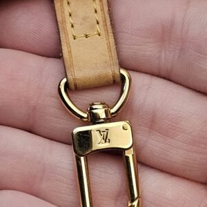 Gold-tone clasp on the interior key strap