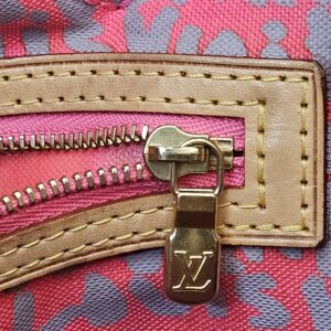 Close up of the interior pocket zip pull