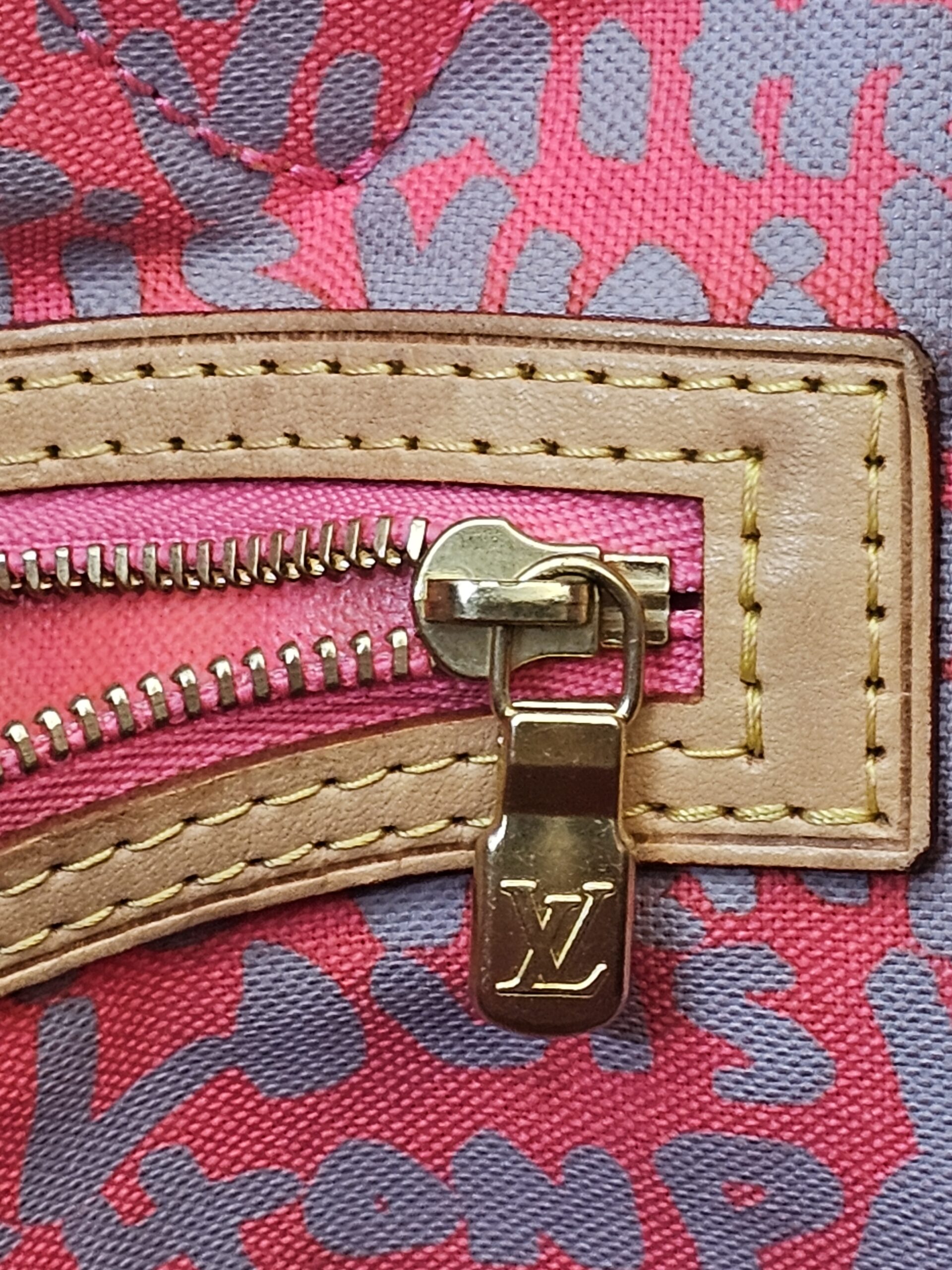 Close up of the interior pocket zip pull