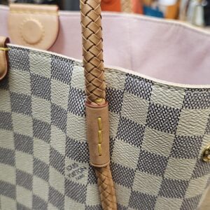 Close up of the braided handle and trim showing honey patina