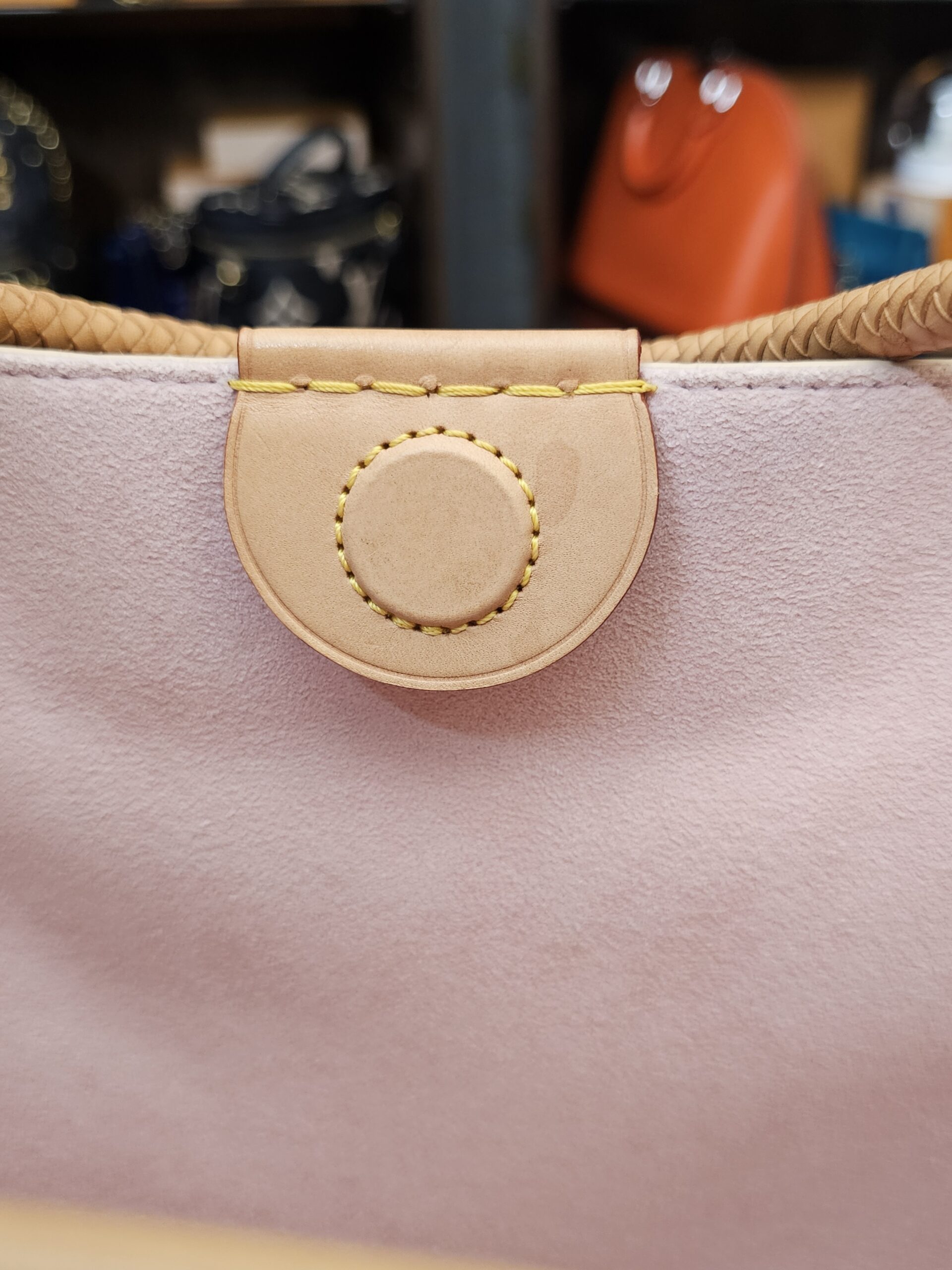 Vachetta tab and pink lining at the top opening