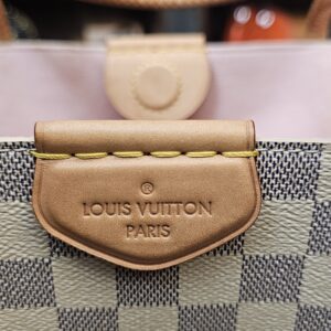 Heat stamp on the vachetta tab