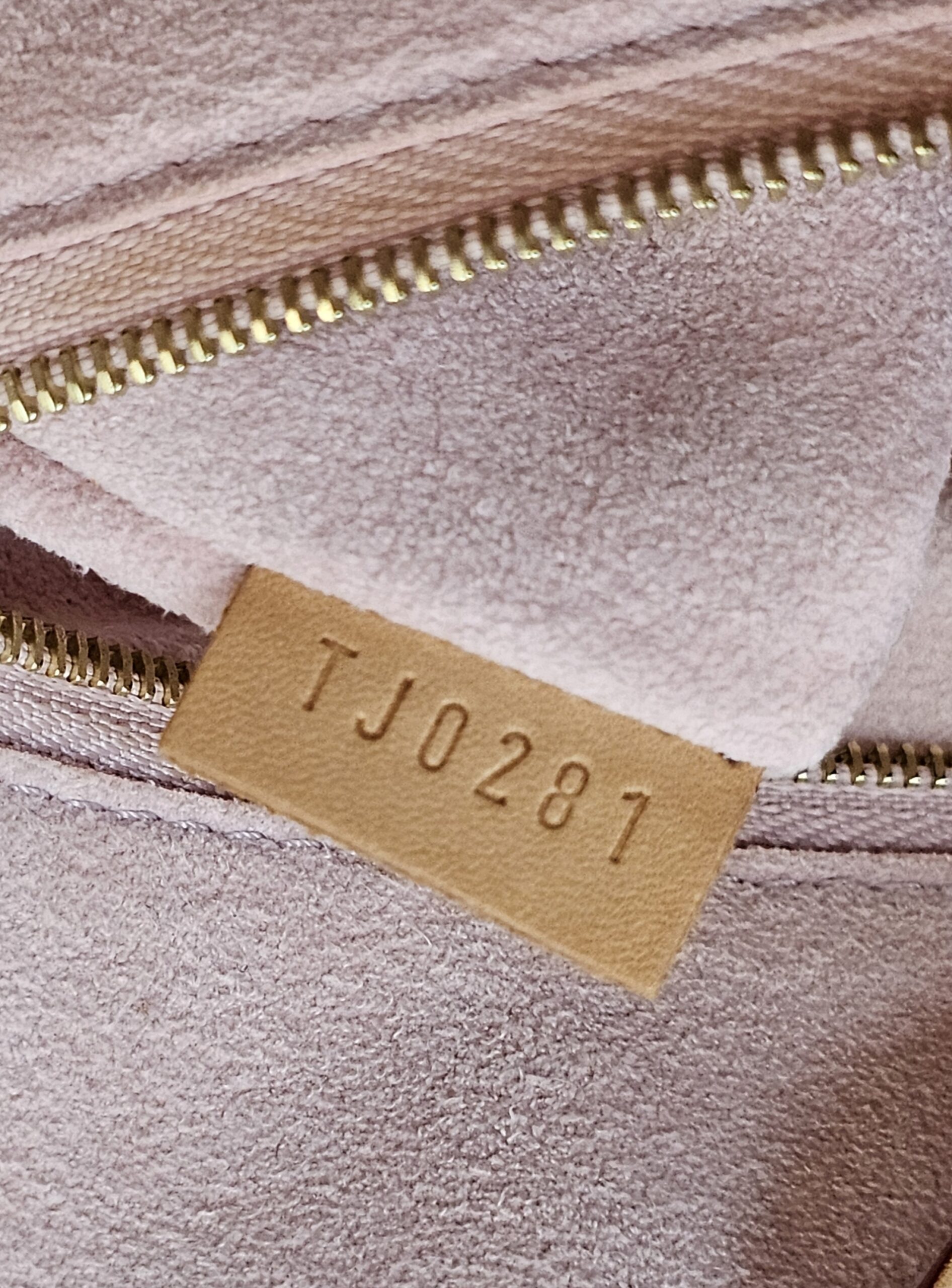 Date code TJ0281 on the interior tab