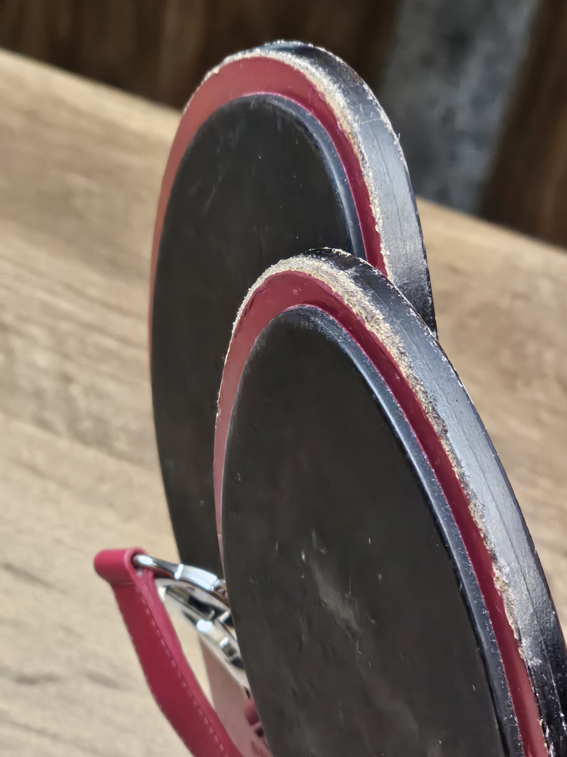 Heel edges showing rubbing and wear on the soles