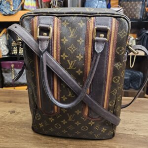 Louis Vuitton Monogram Bequia Porte Document Vertical - front view with the shoulder strap