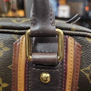 Close up of a handle ring with the burgundy stripe