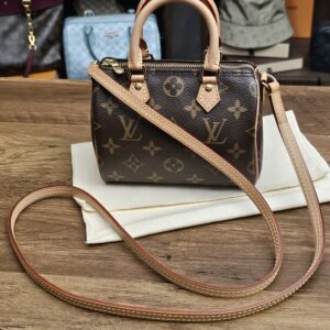 Louis Vuitton Monogram Nano Speedy - front view with the long vachetta shoulder strap
