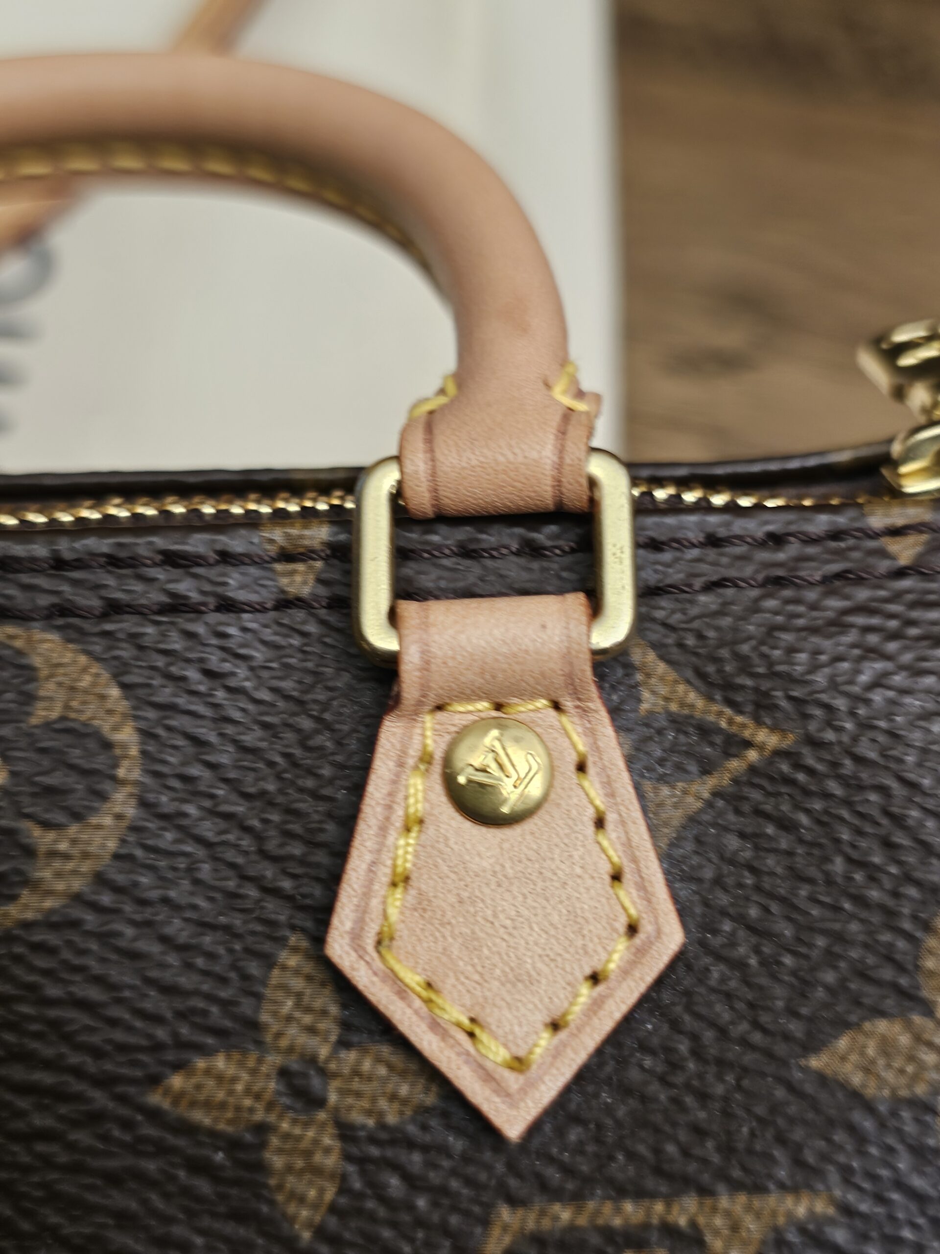Close up of another vachetta tab and rivet