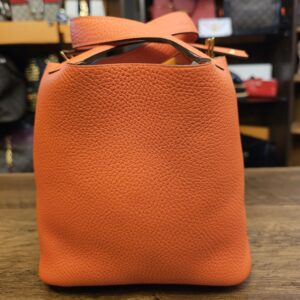 Front of the bag with the closure strap folded