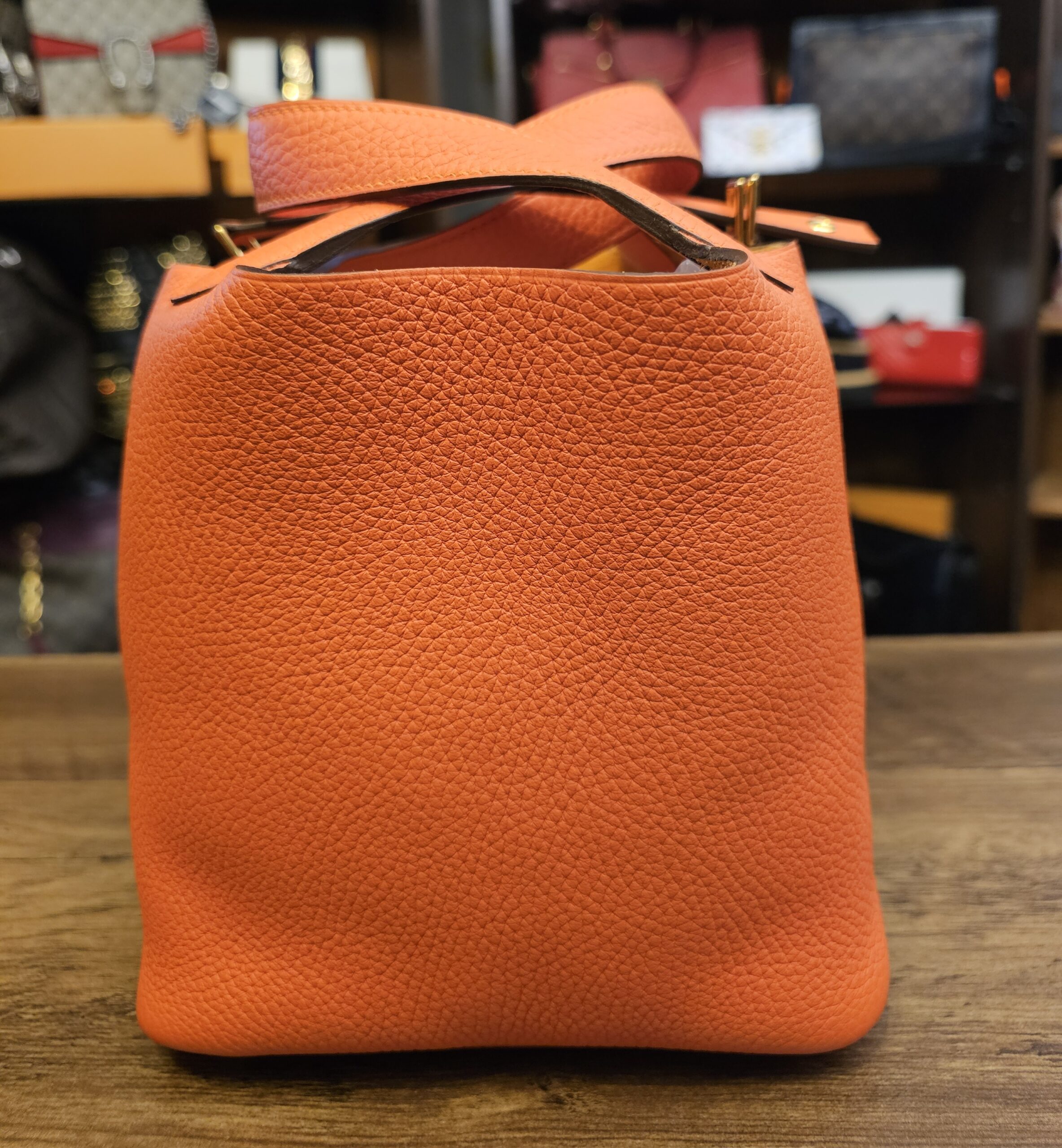 Front of the bag with the closure strap folded