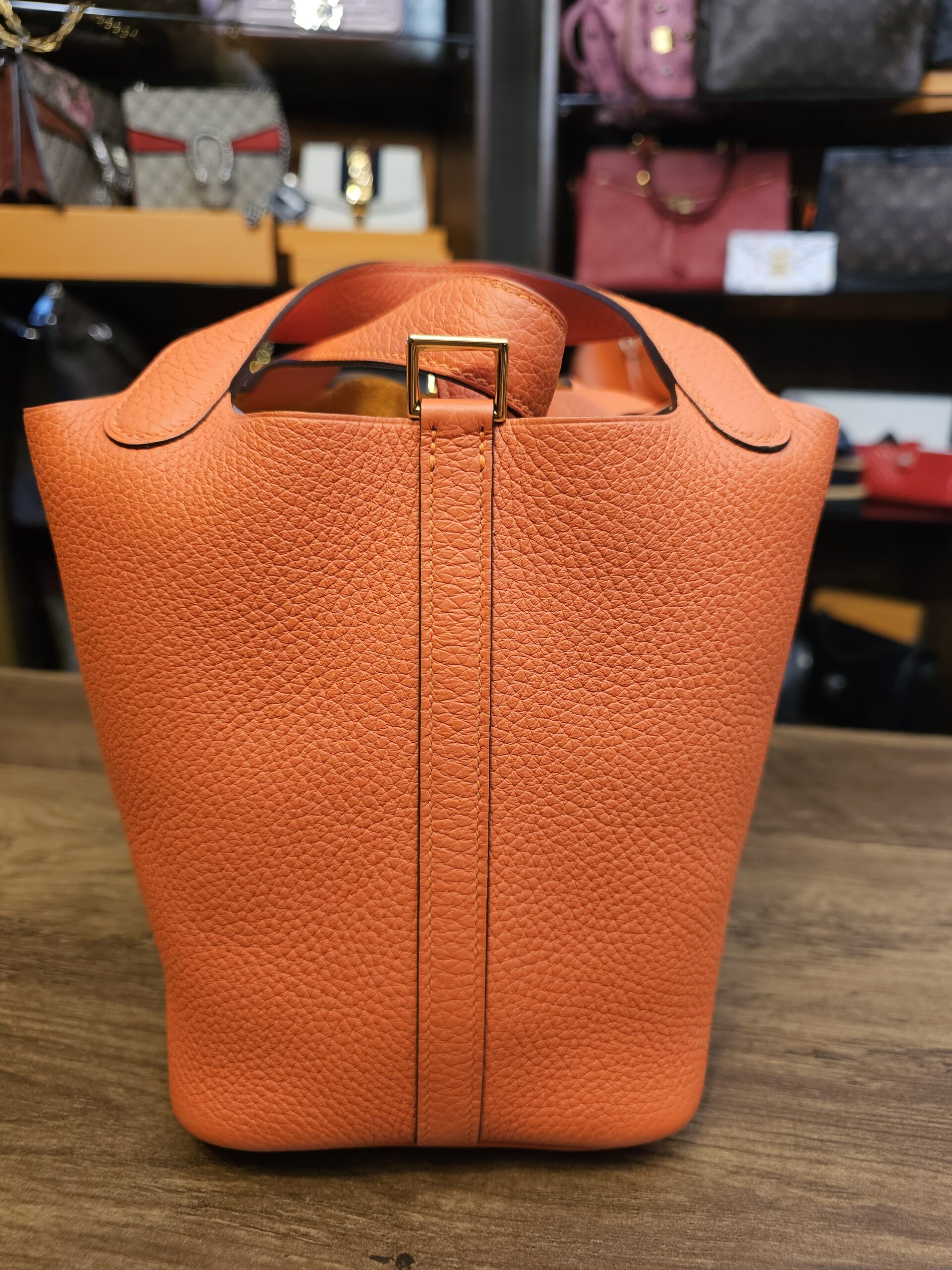 Side with the closure strap running down the center