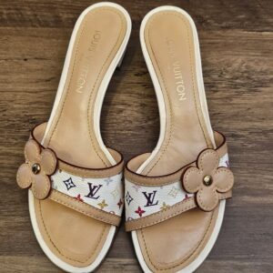 Overhead view of both mules with LOUIS VUITTON stamped insoles