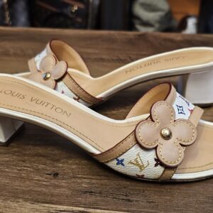 Side view of the pair showing the low white block heels