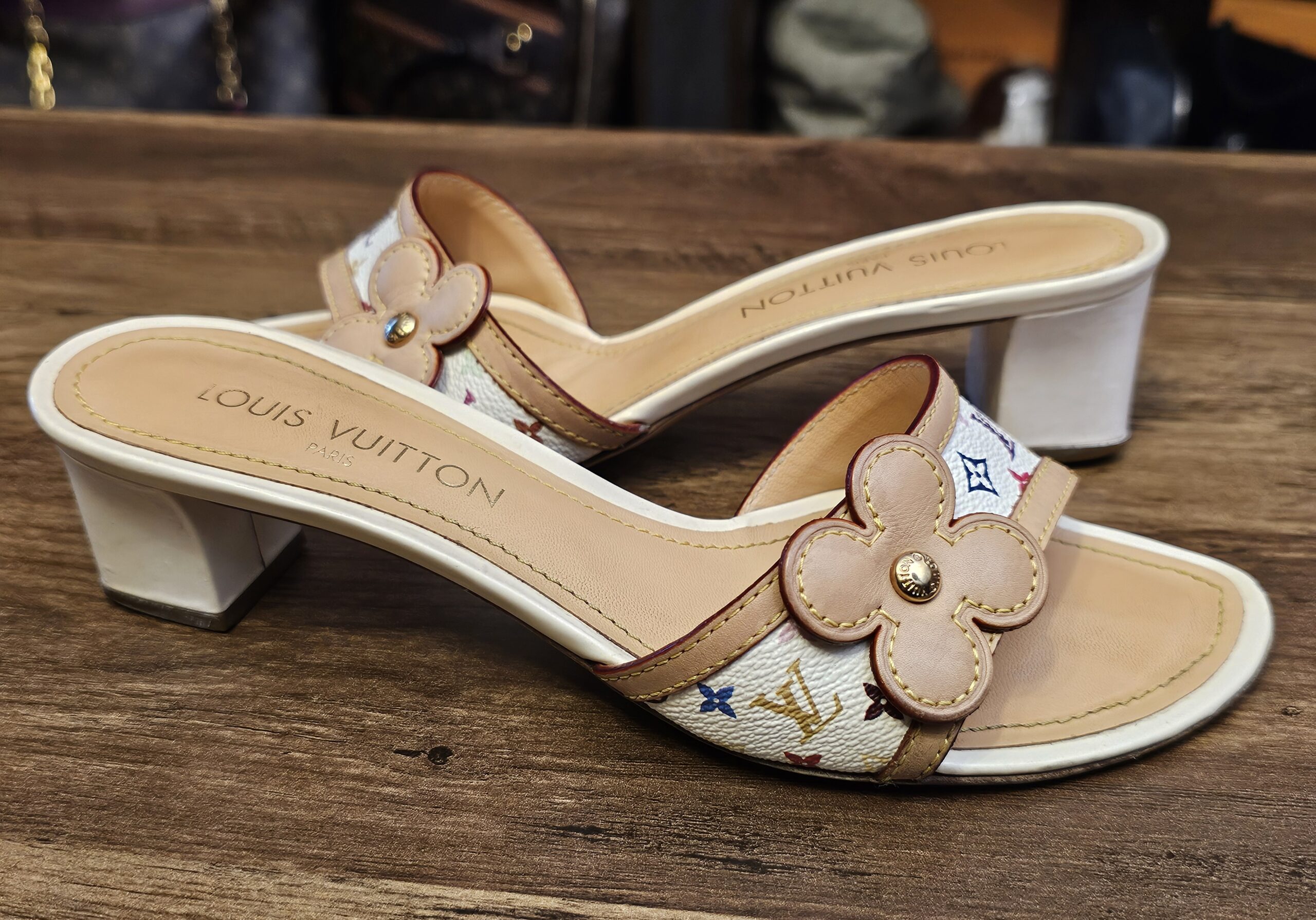 Side view of the pair showing the low white block heels