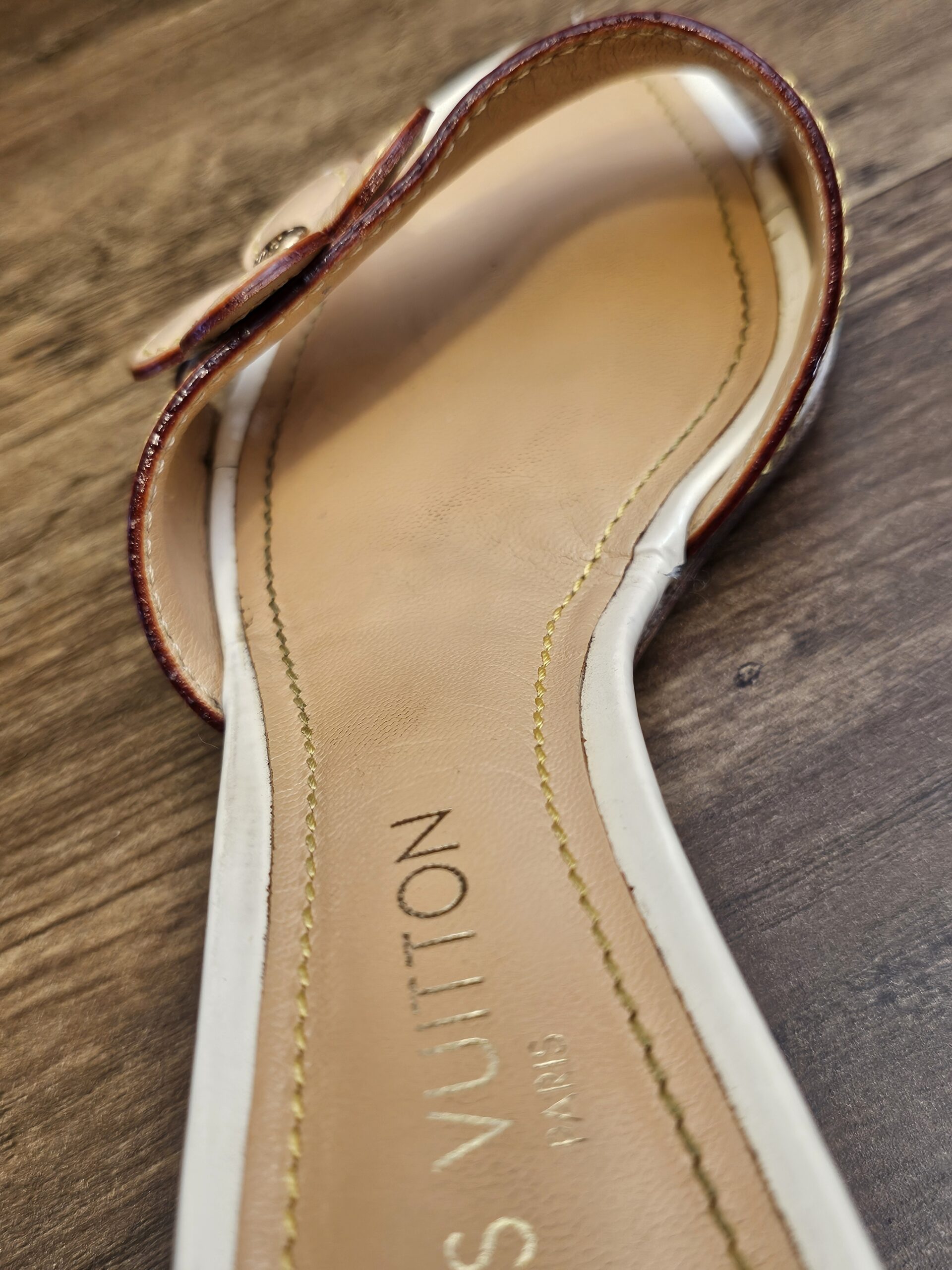 Insole stamped LOUIS VUITTON PARIS showing light wear