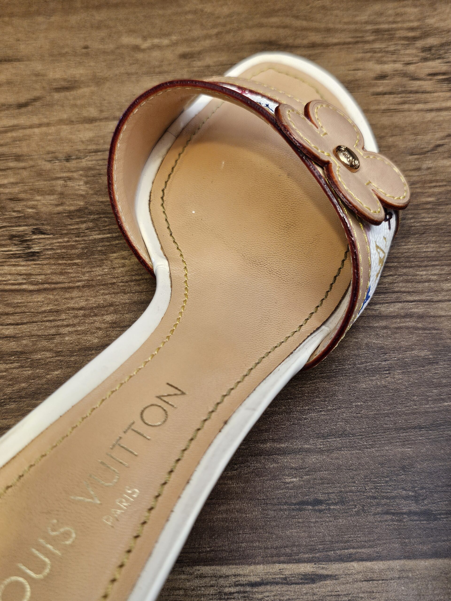 Insole of the other mule showing creasing from wear