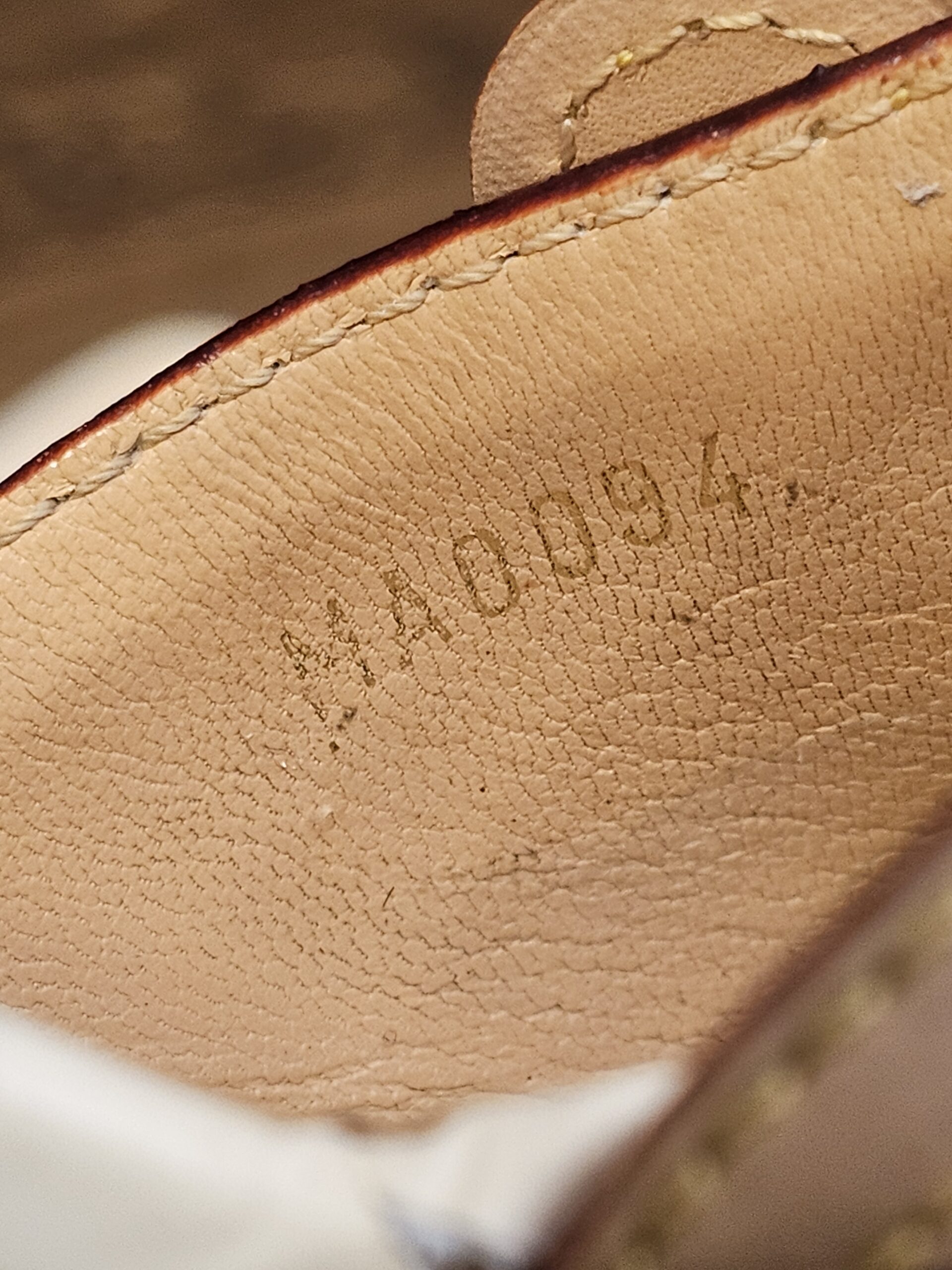 Code MA0094 stamped inside the strap lining