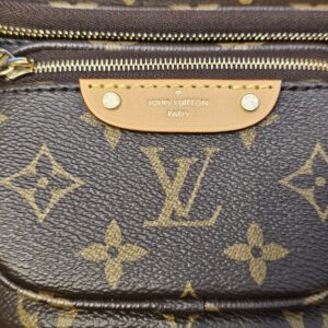 Leather patch on the front pocket stamped LOUIS VUITTON PARIS